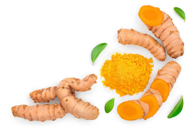 istock Turmeric powder and turmeric root isolated on white background with copy space for your text. Top view. Flat lay 1201010082