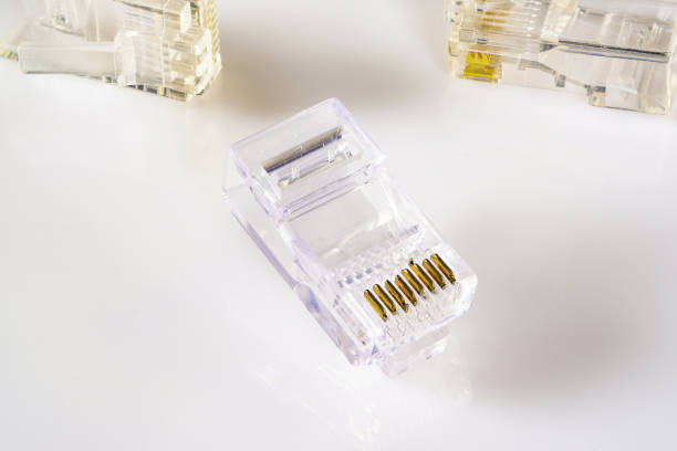 Connector rj-45. Transparent connector rj45 for network and internet. Close-up macro on gloss white background with shadow.