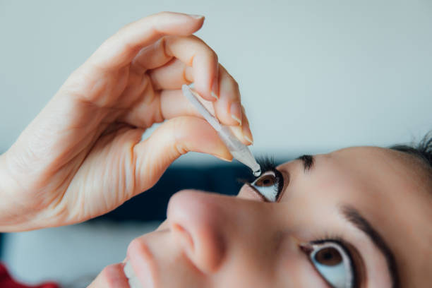 istock woman putting eye drops 1201011305