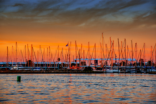 The beautiful colors of sunset beyond a marina on Galveston Bay just south of Houston, Texas.