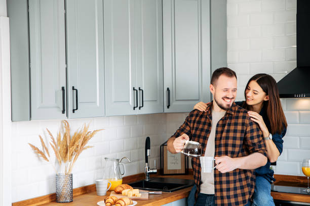 istock Casual couple in the kitchen at breakfast 1201013645