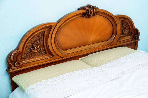 istock Decorative wooden double bed with two pillows and blankets 1201014605