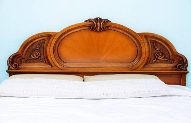 istock Decorative wooden double bed with two pillows and blankets 1201014616