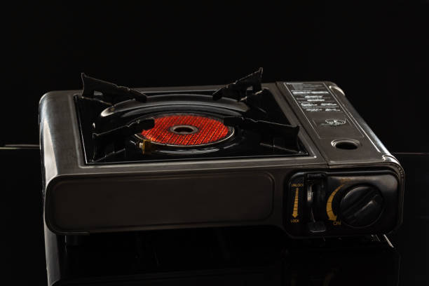 istock Camping portable gas ceramic hob, works and stands on a black 1201014782