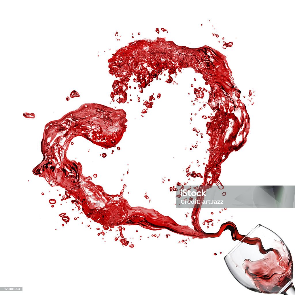 Heart from pouring red wine in glass isolated on white Alcohol - Drink Stock Photo