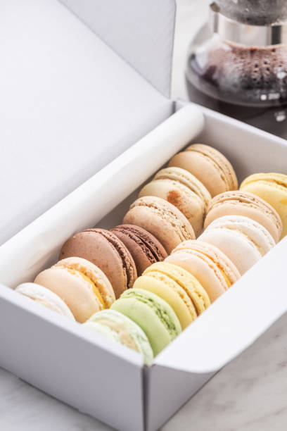 istock Colorful French Macaroons in Box with Coffee 1201017314