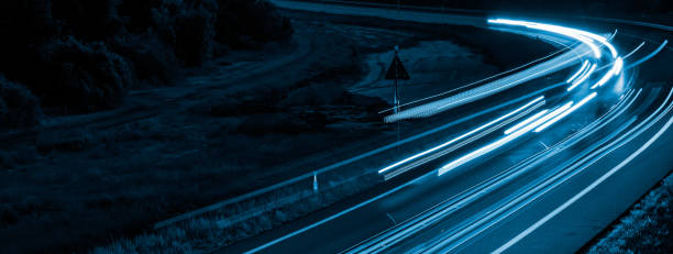 istock lights of cars with night 1201017637
