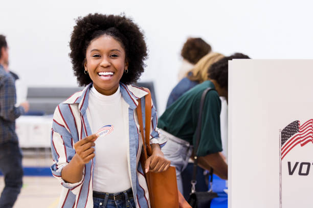 istock Young woman is happy to vote for first time 1201018758
