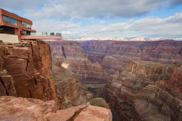 Grand Canyon Skywalk Peach Springs, USA - December 28, 2019. The Grand Canyon Skywalk, a tourist destination in itself, jets out above the deep pit of the canyon. natural pattern pattern nature rock stock pictures, royalty-free photos & images