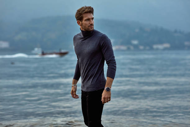 istock Handsome man relaxing on the beach near the lake 1201019200