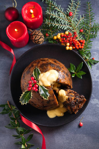 istock Christmas pudding decorated with sprig of holly. Cristmas decorations 1201019437