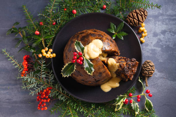 istock Christmas pudding decorated with sprig of holly. Cristmas decorations 1201019487