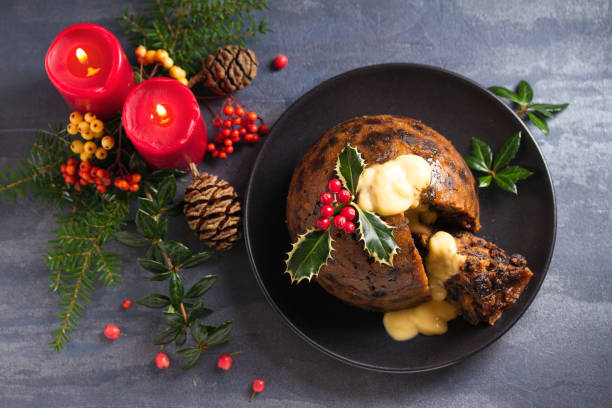 istock Christmas pudding decorated with sprig of holly. Cristmas decorations 1201019528