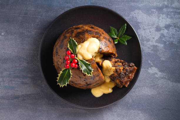 istock Christmas pudding decorated with sprig of holly. Cristmas decorations 1201019541