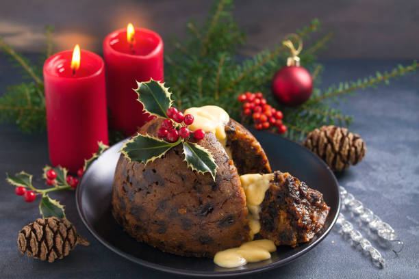 istock Christmas pudding decorated with sprig of holly. Cristmas decorations 1201019600