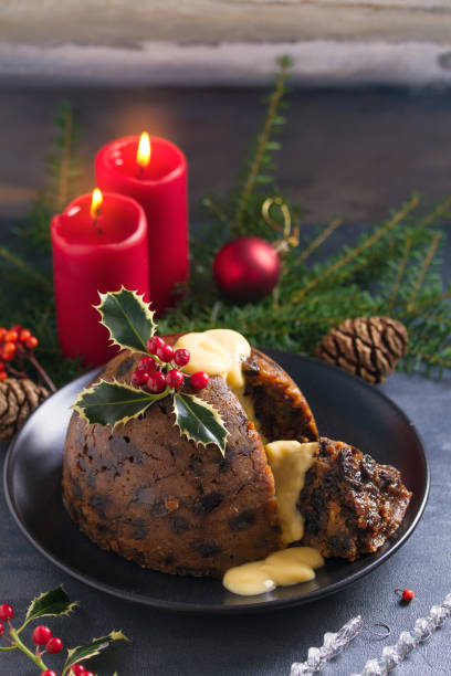 istock Christmas pudding decorated with sprig of holly. Cristmas decorations 1201019625