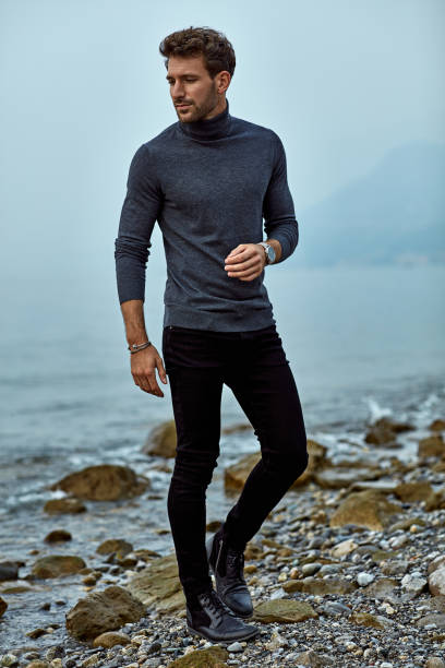 istock Handsome man relaxing on the beach near the lake 1201020397