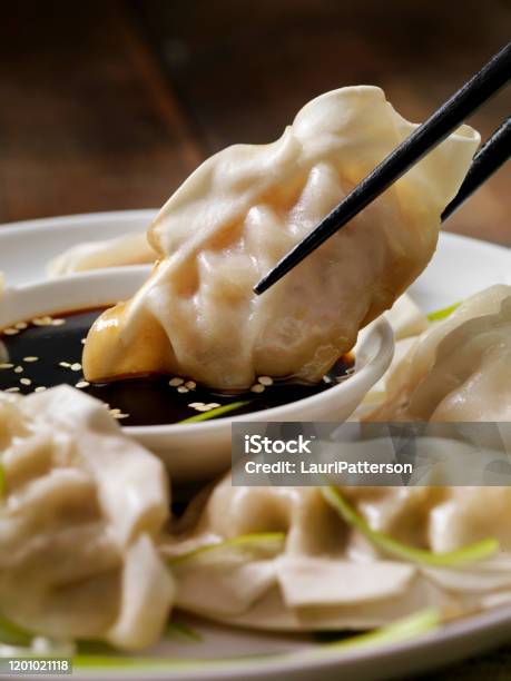 Steamed Asian Pork Dumplings With Soy Sauce And Green Onions Stock Photo - Download Image Now