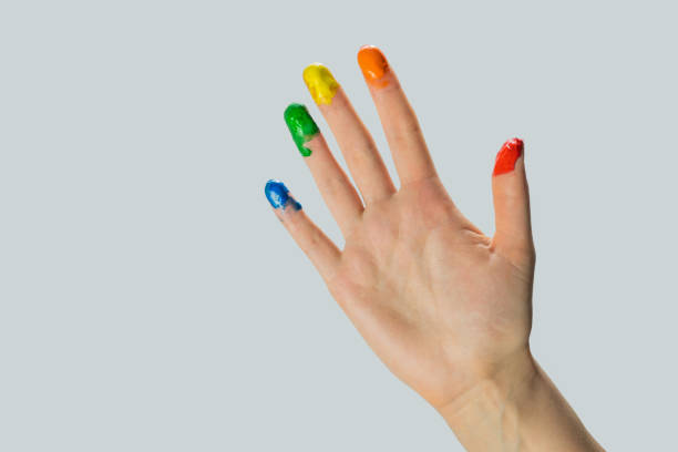 istock Close-up view of a hand with paint on the fingertips. 1201022414