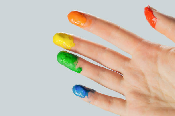 istock Close-up view of a hand with paint on the fingertips. 1201022457
