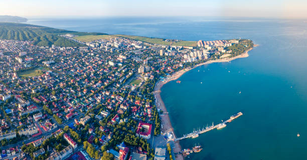 istock Gelendzhik shooting from a drone. A steep, Thick promontory with a lighthouse and the Central part of the city with a sea pier. 1201024552