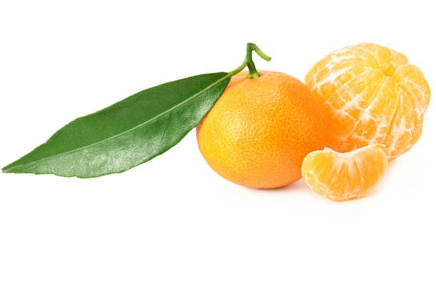 istock mandarin with slices and green leaf isolated on white background 1201026496