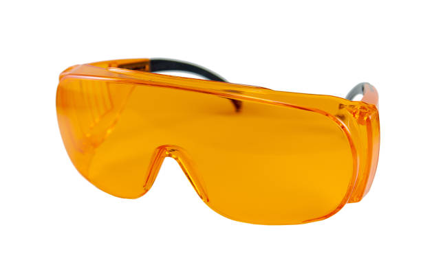 istock orange protective glasses in dentistry for work with UV lamp, glasses 1201026535