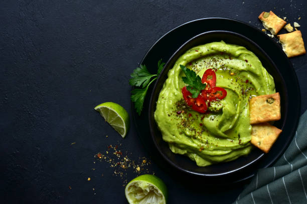 istock Guacamole - traditional mexican spicy avocado dip 1201027867