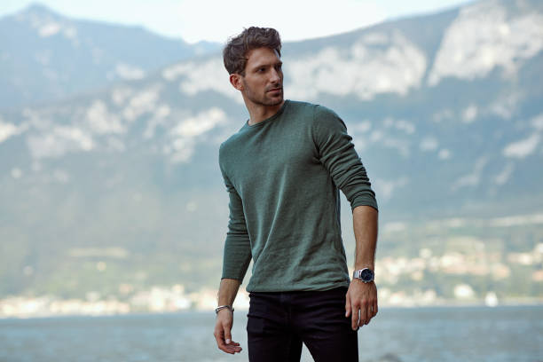 istock Handsome man in casual clothing relaxing on the beach 1201028006