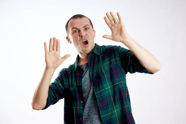istock Fear and fright of a man. Guy is afraid, scared face 1201030366