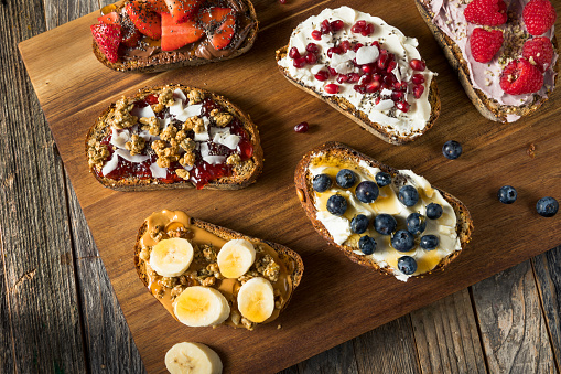 Homemade Sweet Gourmet Breakfast Toasts with Cream Cheese and Berries