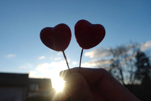 istock Two heart on sunset background, valentine's Day, 1201032476