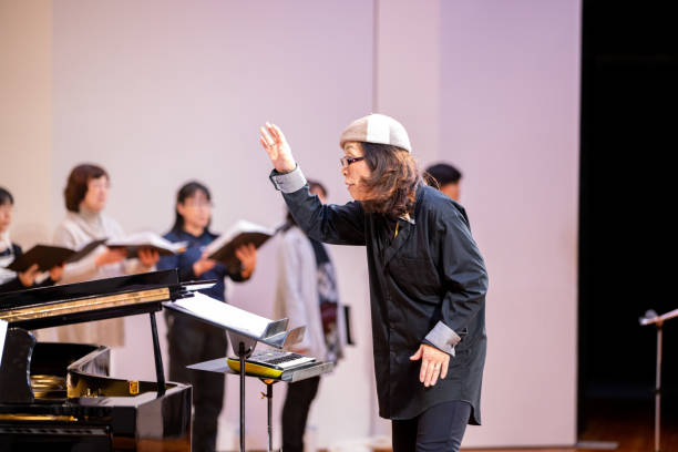 istock Musical conductor leading the concert 1201035131