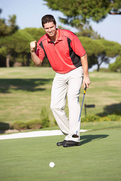 istock Male Golfer On Golf Course Putting Shot 120103703