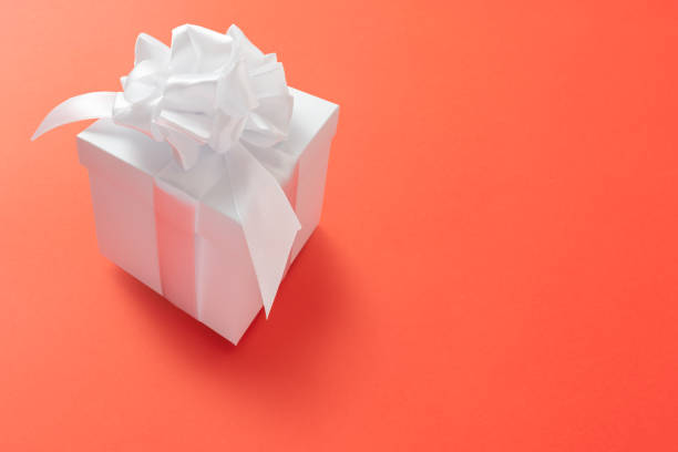 istock Gift box minimal background. Lush lava 2020 color trend 1201037362