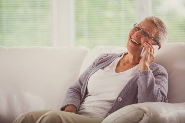 istock Senior woman talking on mobile phone 1201050037