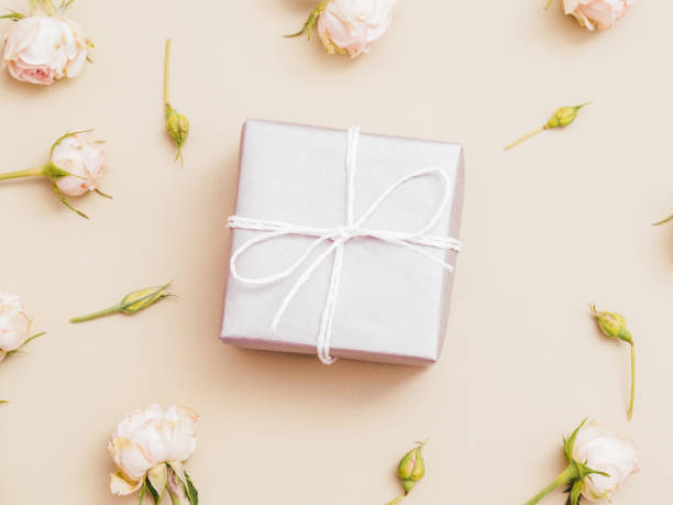 istock women day present silver gift box pink roses 1201050097