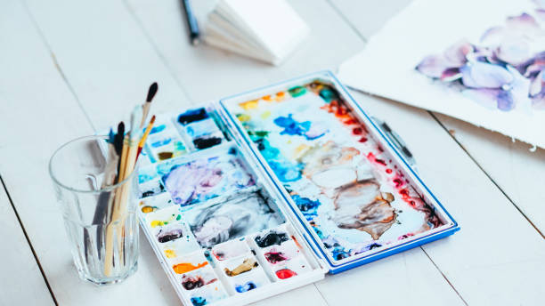 istock fine art school watercolor palette paintbrushes 1201050134