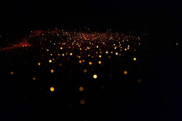 istock Beautiful blurred golden background on black 1201050515