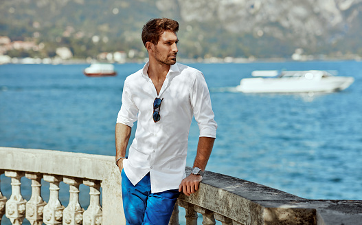 Young handsome man in daily summer outfit relaxing in Italy during vacation