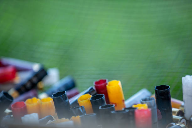 Close-up Photo of a Pile of Used Shotgun Shells - stock photo Close-up Photo of a Pile of Used Shotgun Shells trap shooting stock pictures, royalty-free photos & images
