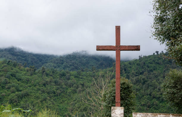 istock Wooden cross on lush mountain top. 1201056164