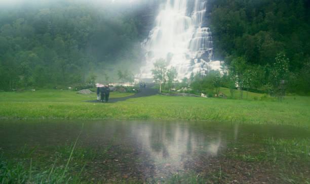 People next to Tvindefossen waterfall near Voss in Norway