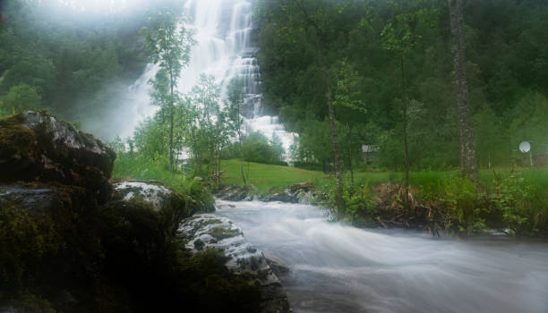istock People next to Tvindefossen waterfall near Voss in Norway 1201057259