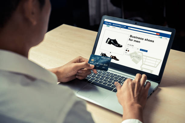 istock Young man use credit card for online shopping 1201074451