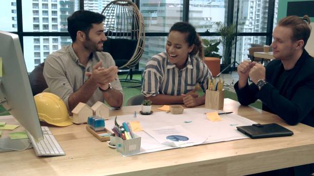 istock Creative business people group having conversation at office desk in workplace. 1201076667