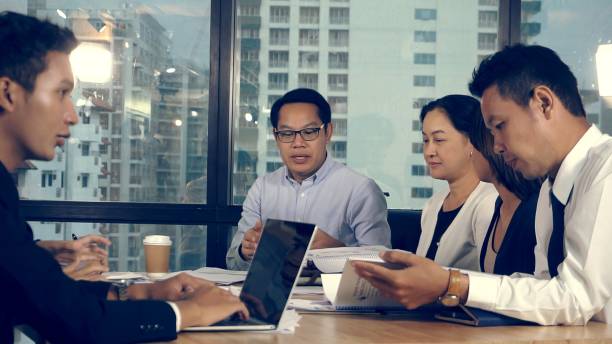 istock Asian business people discuss marketing strategy. 1201076735