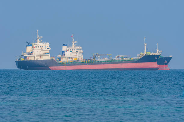 istock Cargo ship sailing to the port. 1201079056