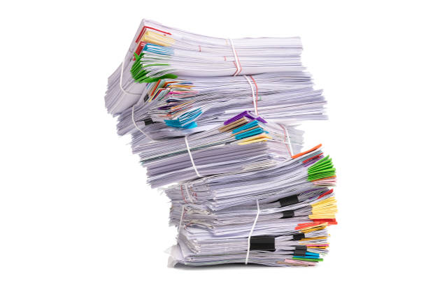 istock Stack of business papers isolated on white background 1201079275