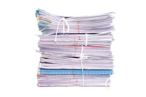 istock Stack of business papers isolated on white background 1201079323